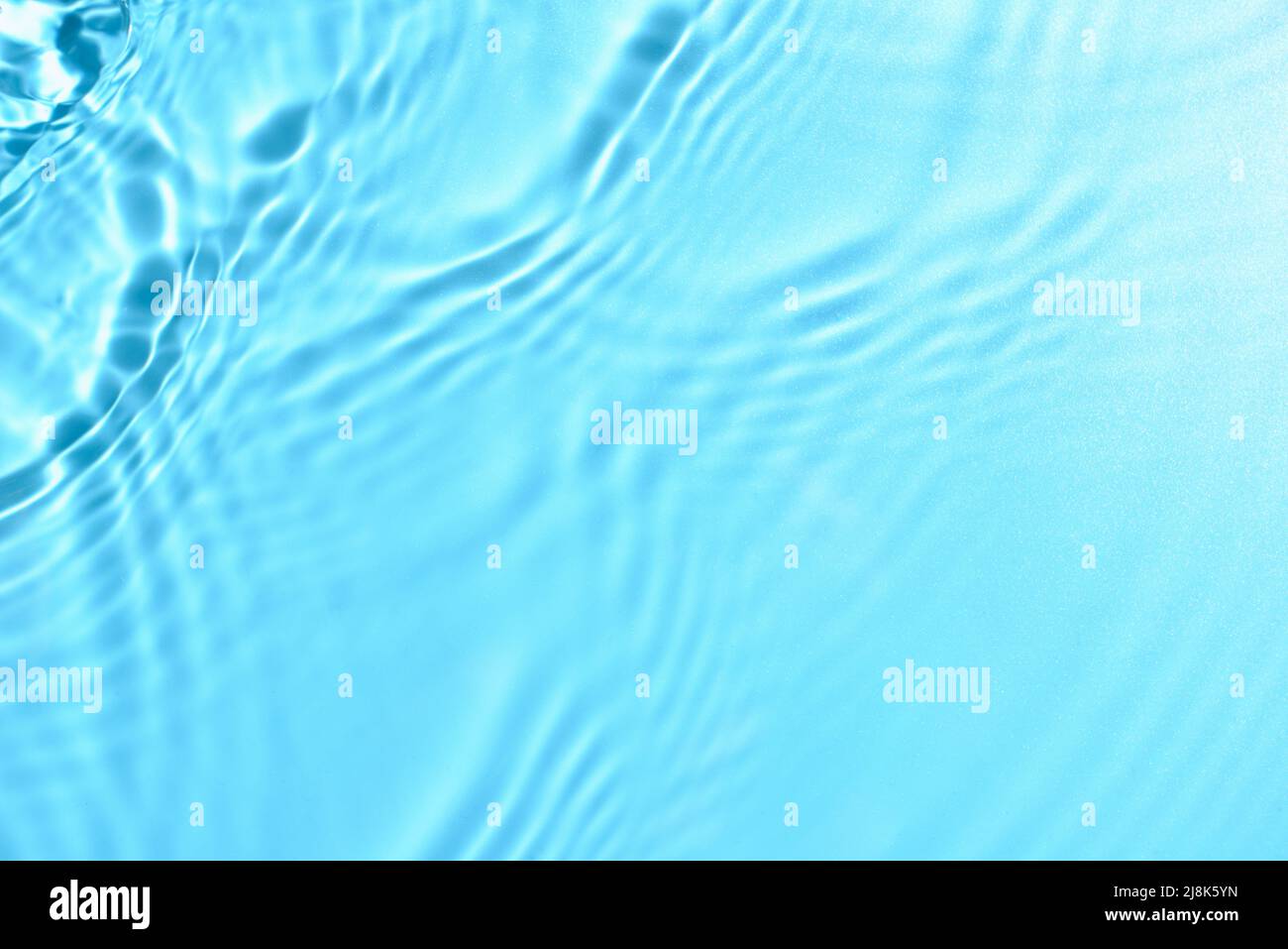 Texture of water with ripples on blue background, closeup Stock Photo ...