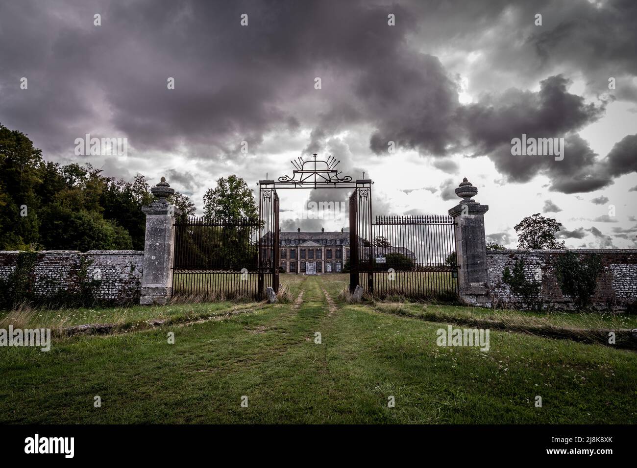 The old and rustic gates from an abandoned country house Stock Photo