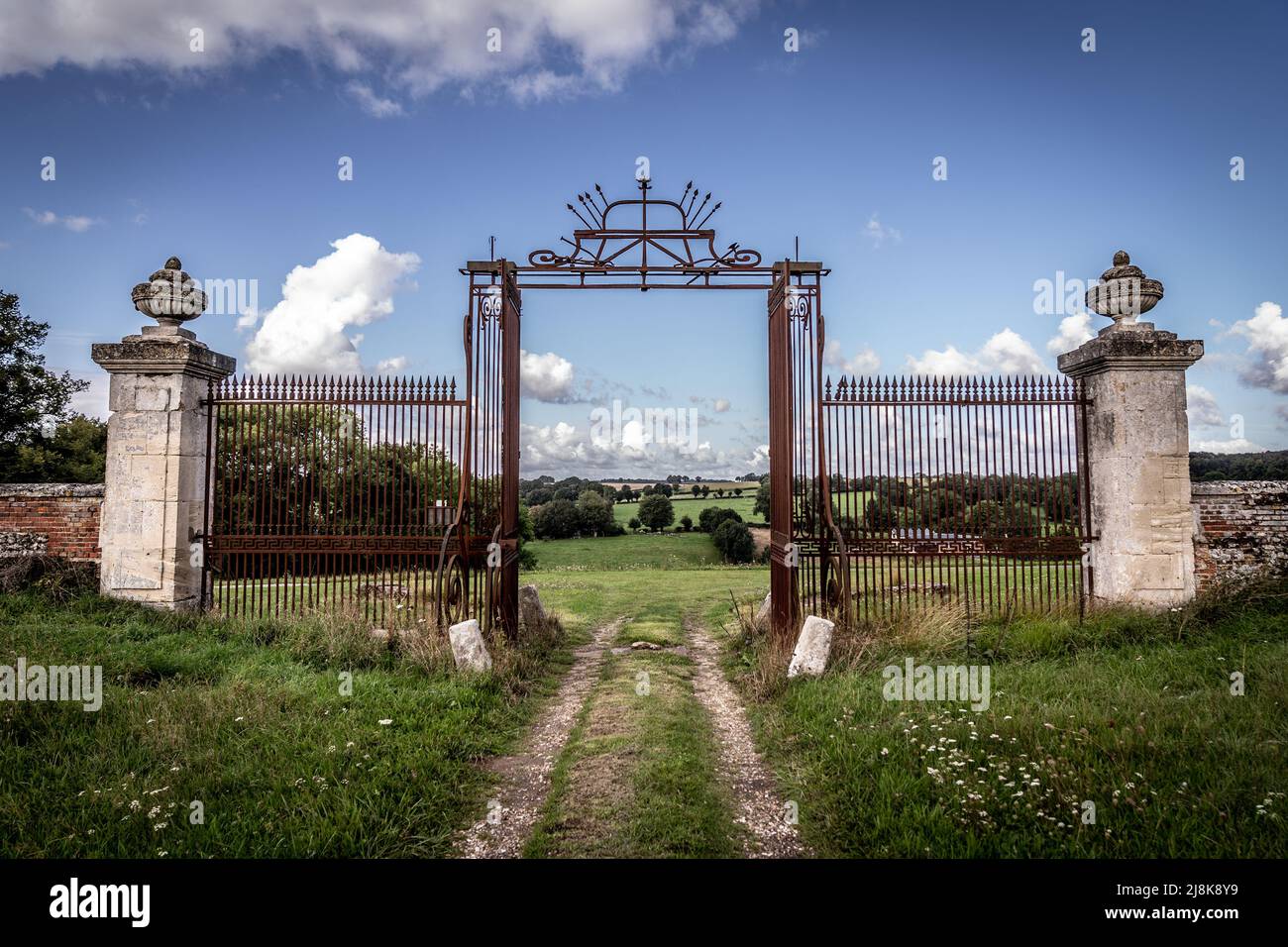 The old and rustic gates from an abandoned country house Stock Photo
