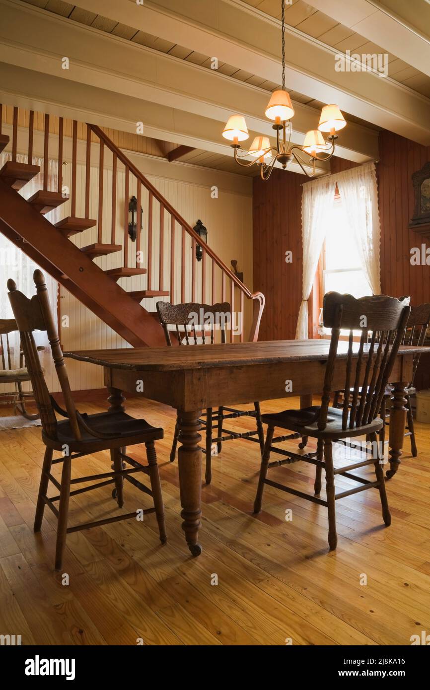 Antique table and high back Windsor chairs in dining room inside old ...