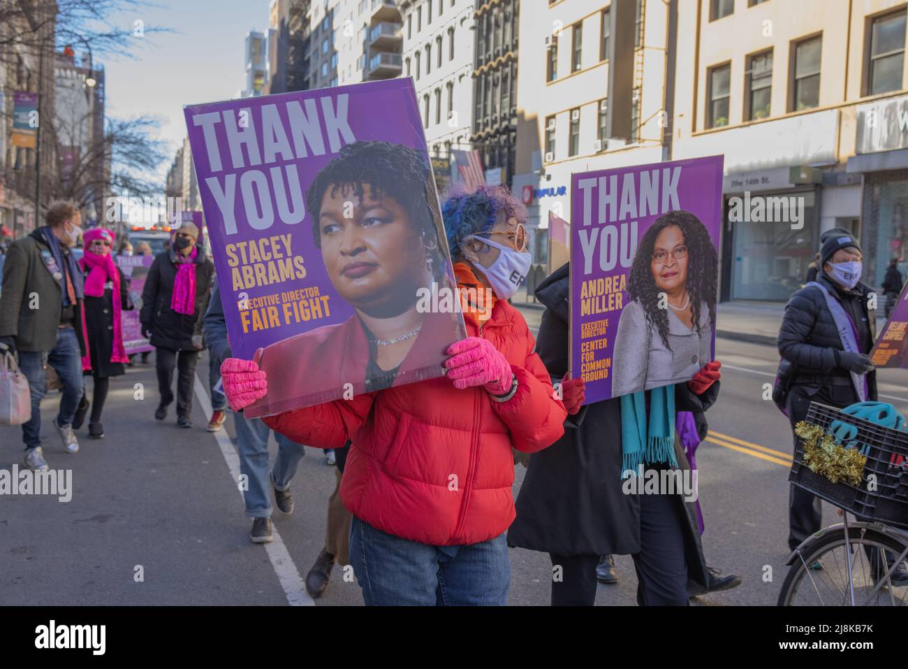 NEW YORK, N.Y. – March 7, 2021: Demonstrators carry signs thanking Stacey Abrams and Andrea Miller at a rally in support of the Equal Rights Amendment. Stock Photo