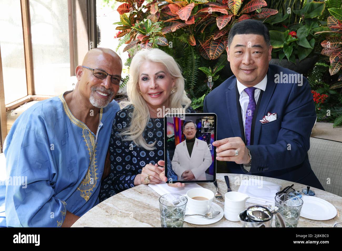 Los Angeles, California, USA. 10th May, 2022. Artist/actor Michael Warren, Princess Karen Cantrell, Jiannan Huang (iPad), and TV  host Joey Zhou attending an interview with LABA Blue-chip artist Jiannan Huang by video conference at the Four Seasons Hotel Los Angeles at Beverly Hills in Los Angeles, California. Credit: Sheri Determan Stock Photo