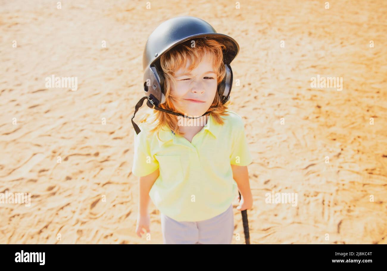 Funny child playing Baseball, winking. Batter in youth league getting a ...