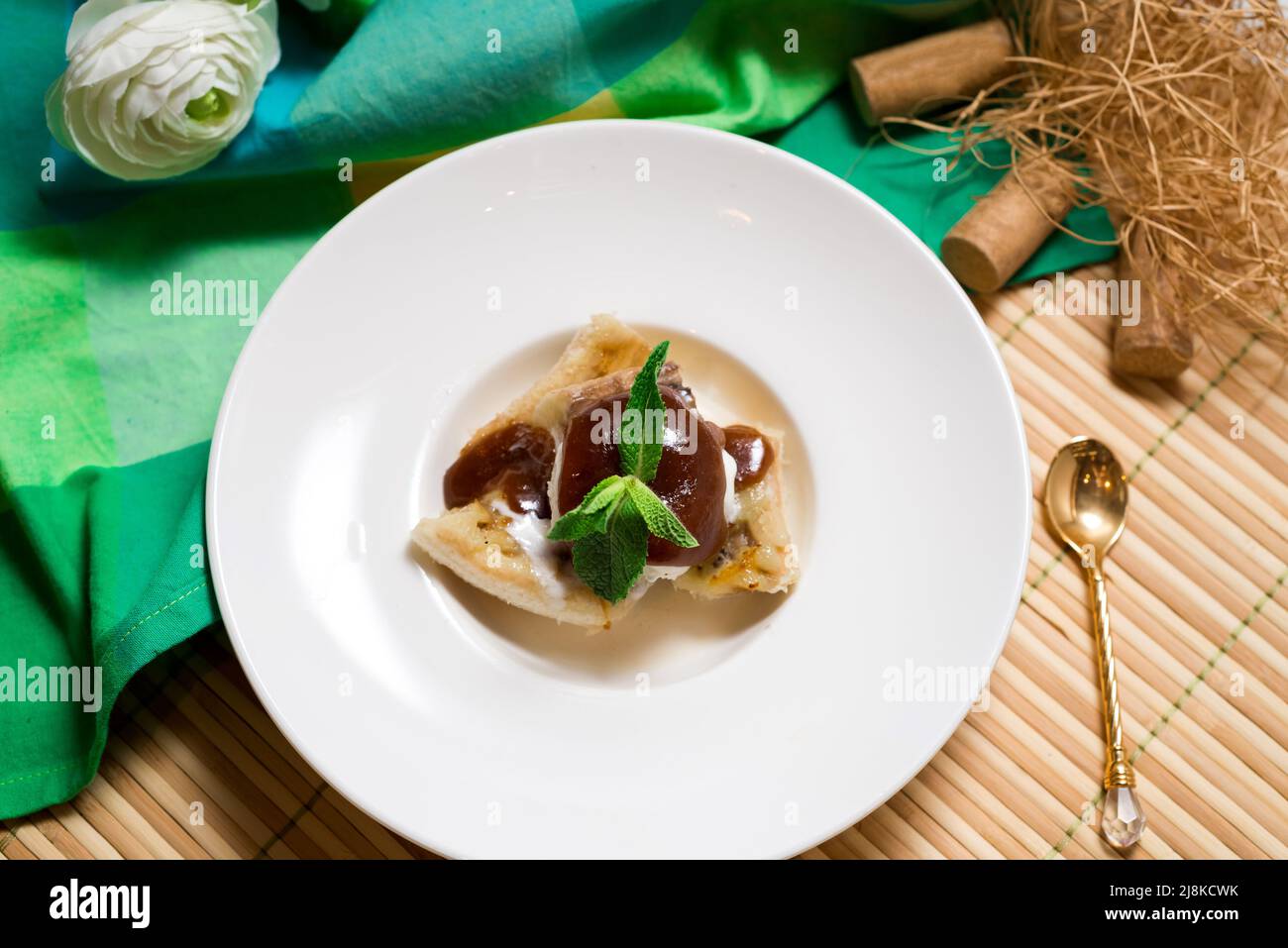 Banana Foster dessert with fried bananas and vanilla ice cream with