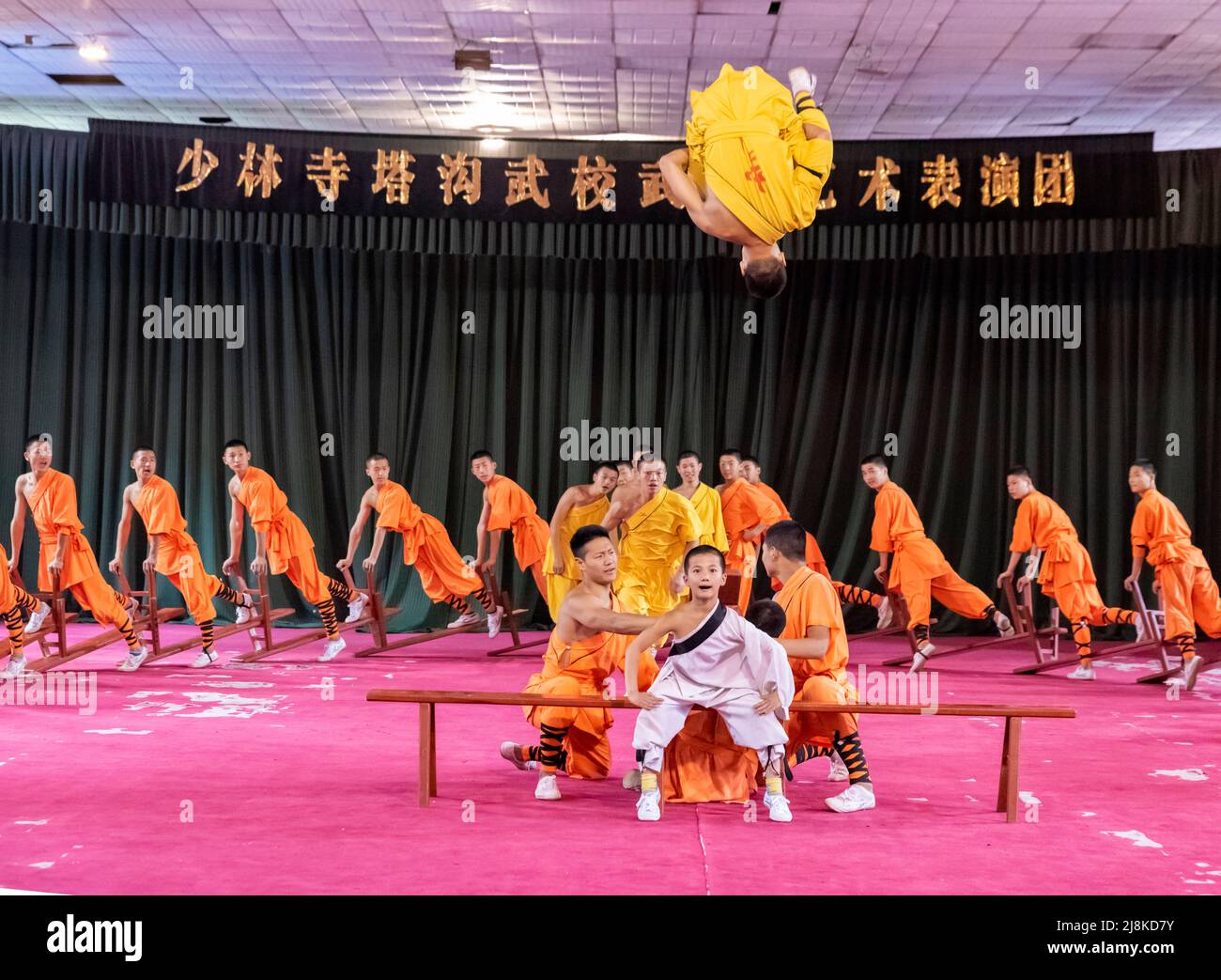 Apprentices at the famous Shaolin Temple at Dengfeng, Henan, China perform their martial arts and acrobatic skills. Stock Photo