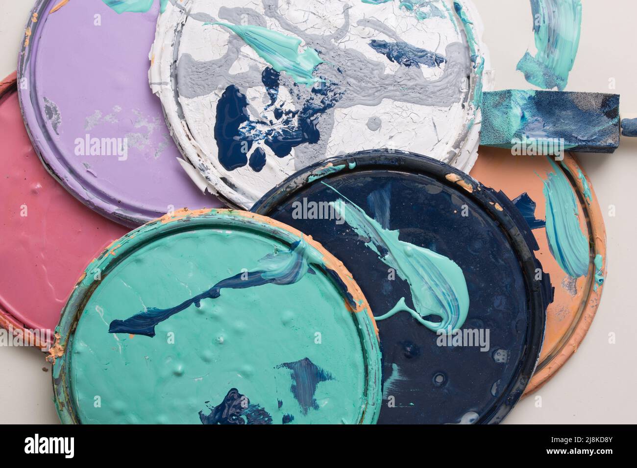 multi color old paint can lids Stock Photo Alamy