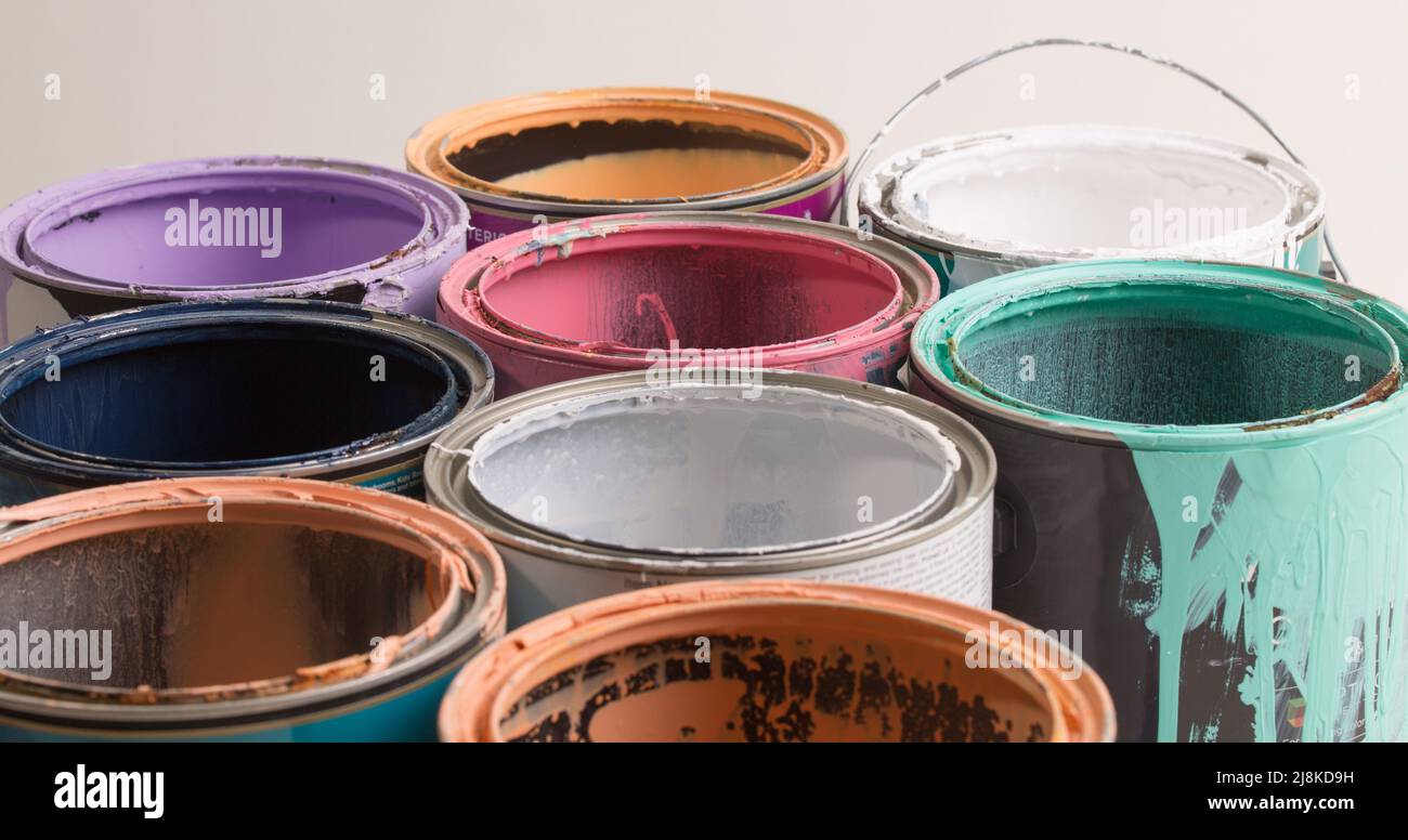 multi color old paint cans on a white background isolated Stock Photo