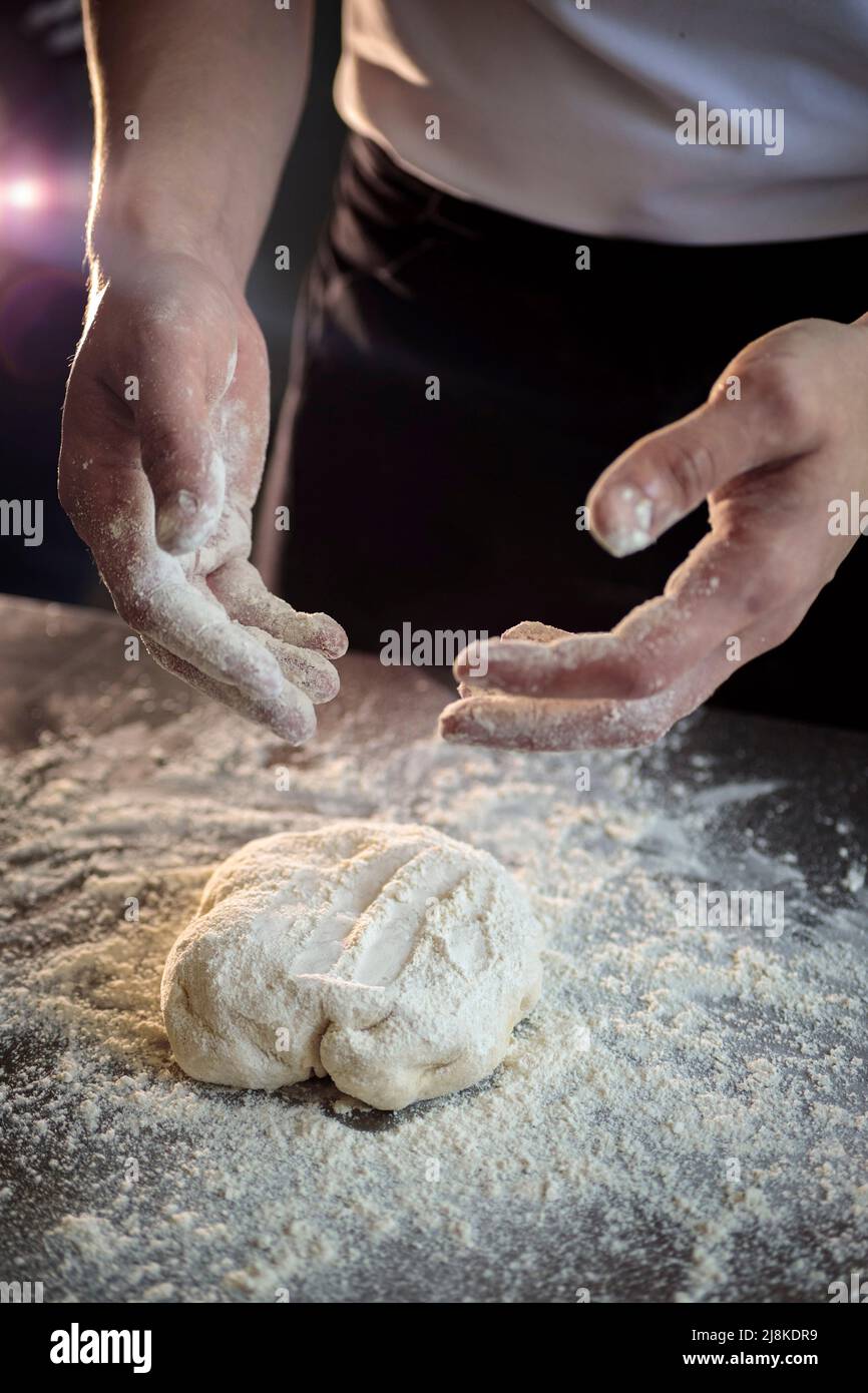 hands of the cook kneading pizza dough close-up Stock Photo - Alamy