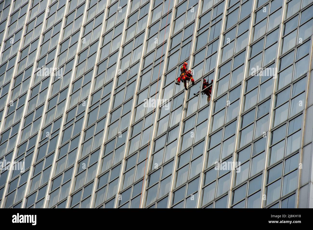 Firefighters scaling the outside of the Park InnHotel in Alexanderplatz, Berlin for the Annual Berlin Firefighter Stair Run Competition. Stock Photo