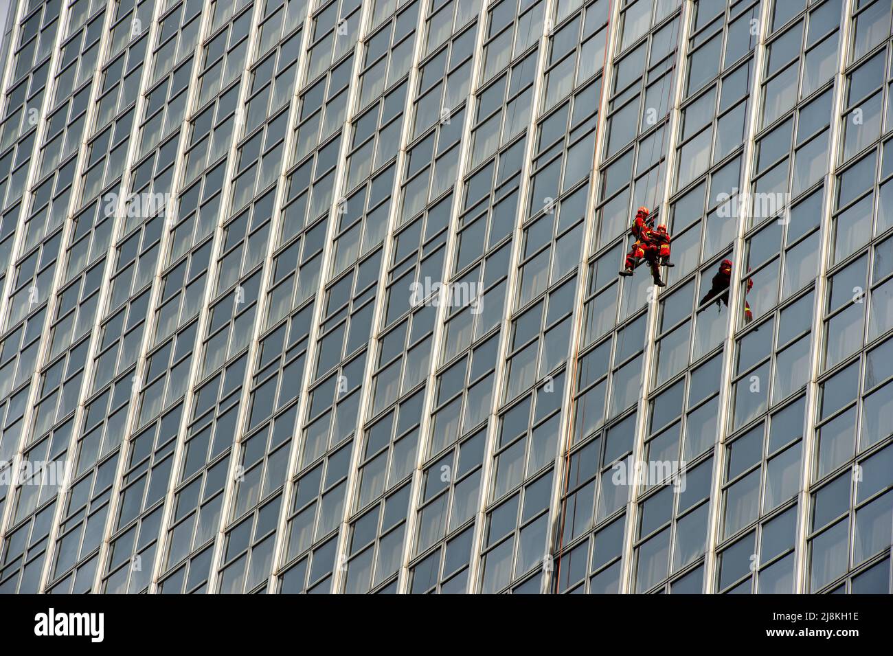 Firefighters scaling the outside of the Park InnHotel in Alexanderplatz, Berlin for the Annual Berlin Firefighter Stair Run Competition. Stock Photo