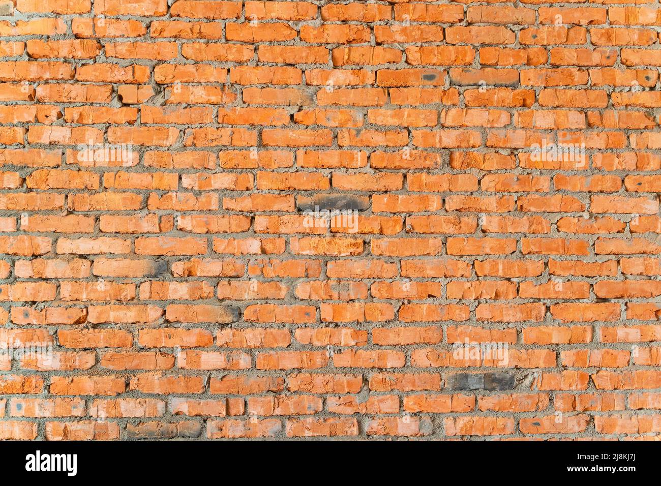 Wallpaper from a brick wall. Full screen red brick wall. Construction