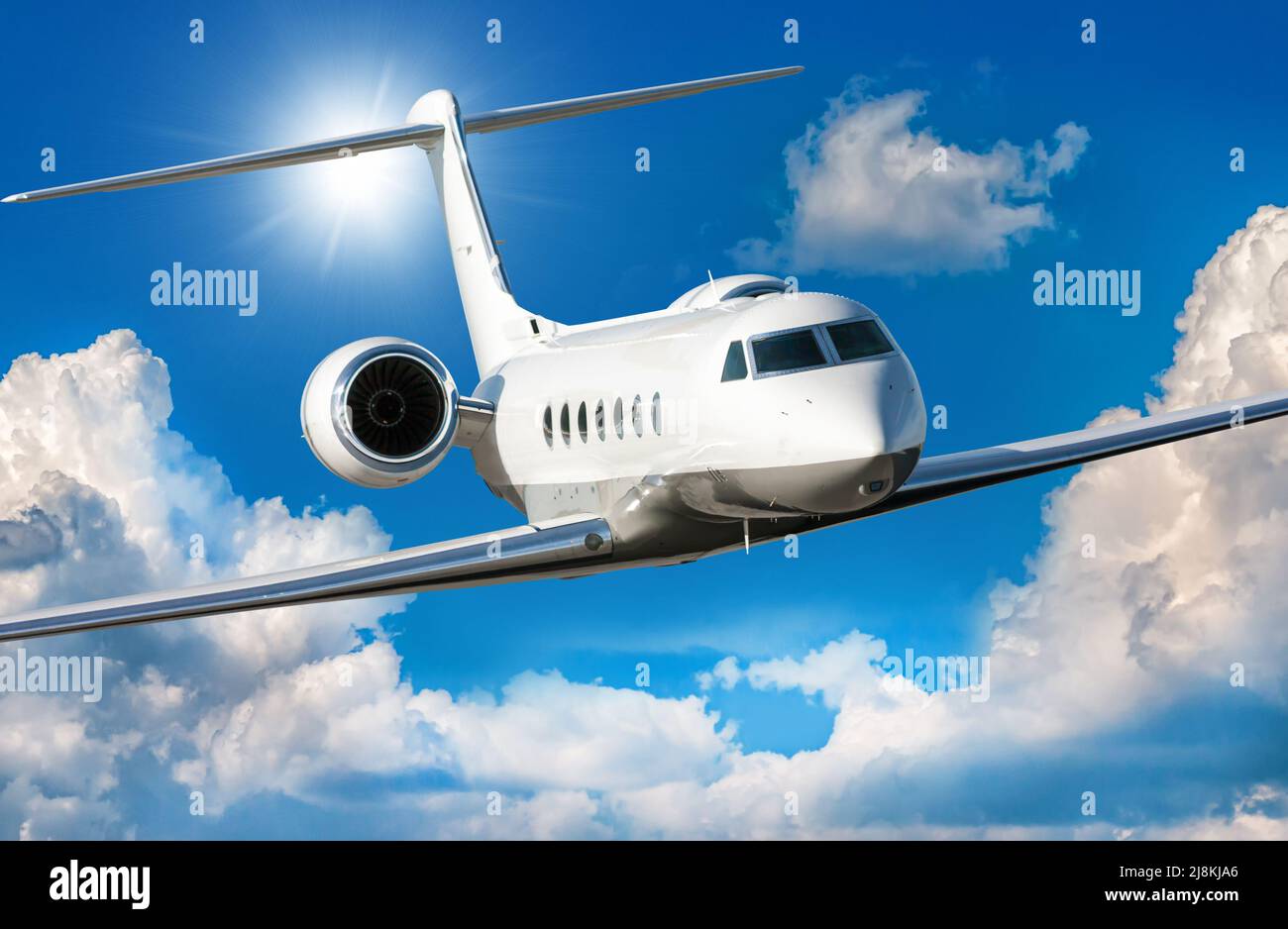 White luxury private jet flies in the air Stock Photo Alamy