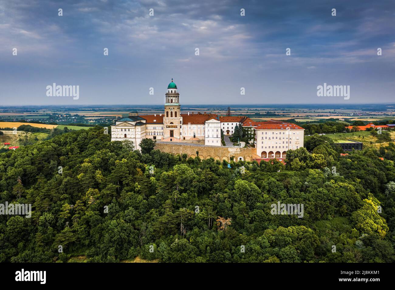 Pannonhalma, Hungary - Aerial view of the beautiful Millenary Benedictine Abbey of Pannonhalma (Pannonhalmi Apatsag) with blue sky and green summer fo Stock Photo
