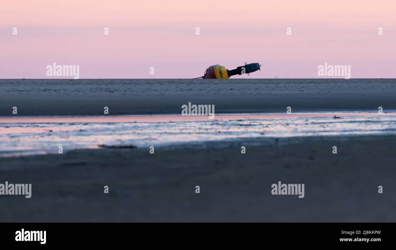 Stranded buoy on East Frisian Island of Spiekeroog, Germany Stock Photo