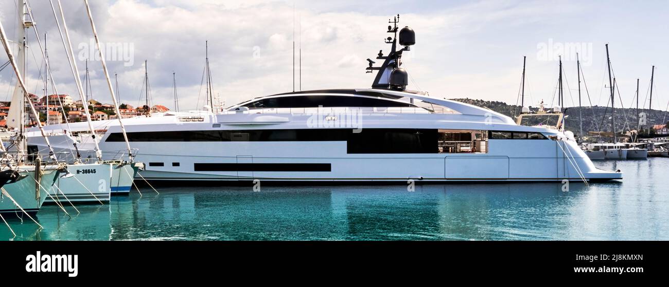 Rogoznica, Croatia, May 3, 2022: Luxurious impressive yacht in Marina Frapa, with blacked out side windows and large radar system Stock Photo