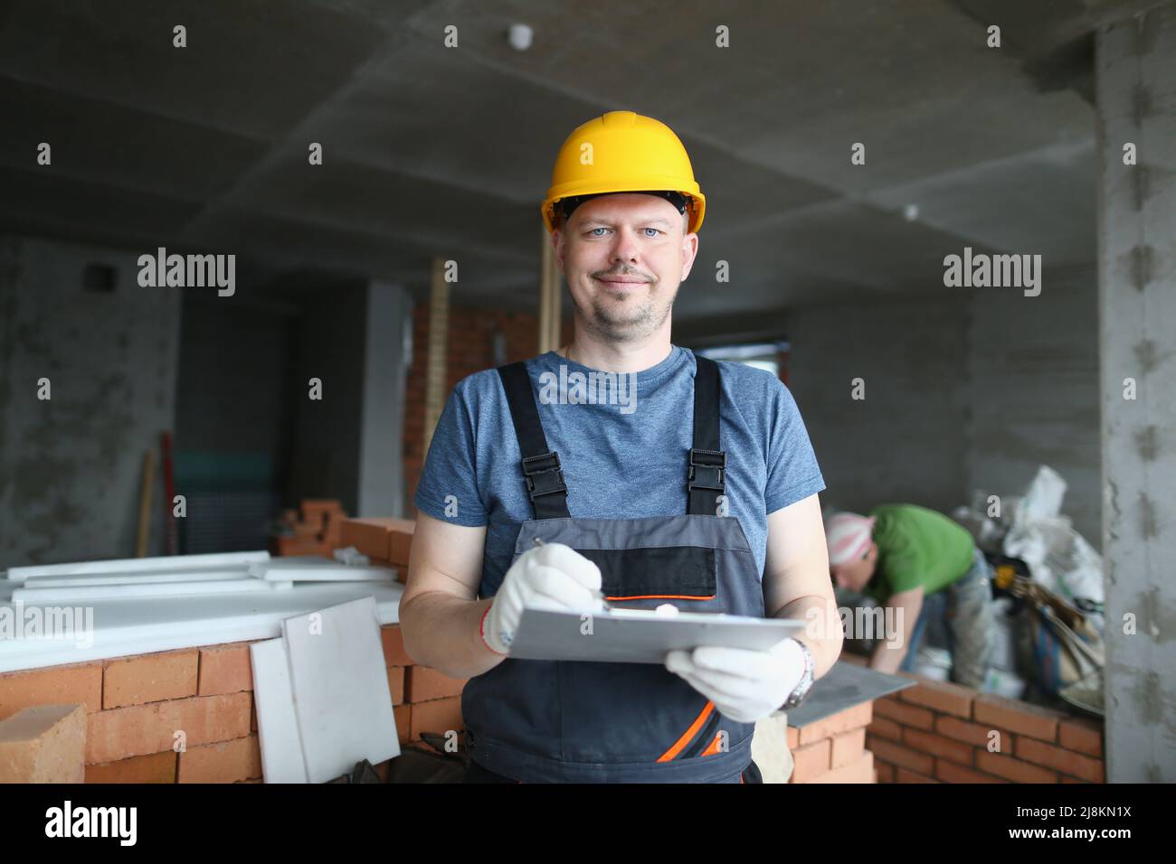 Worker hold clipboard and write down consumable materials for