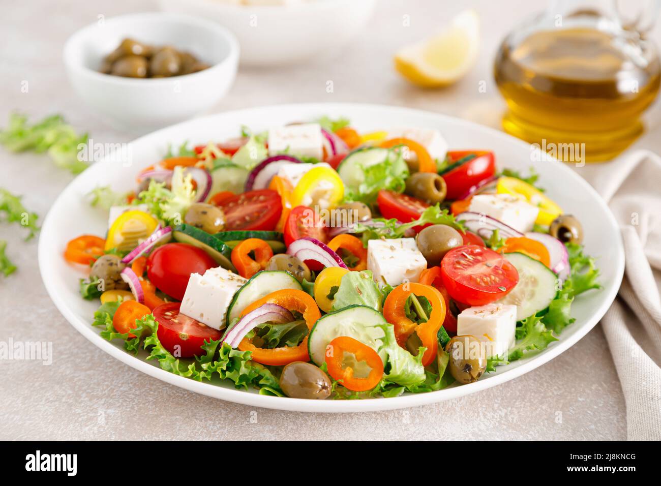 Greek salad with feta cheese, tomatoes, cucumbers, pepper, red onion