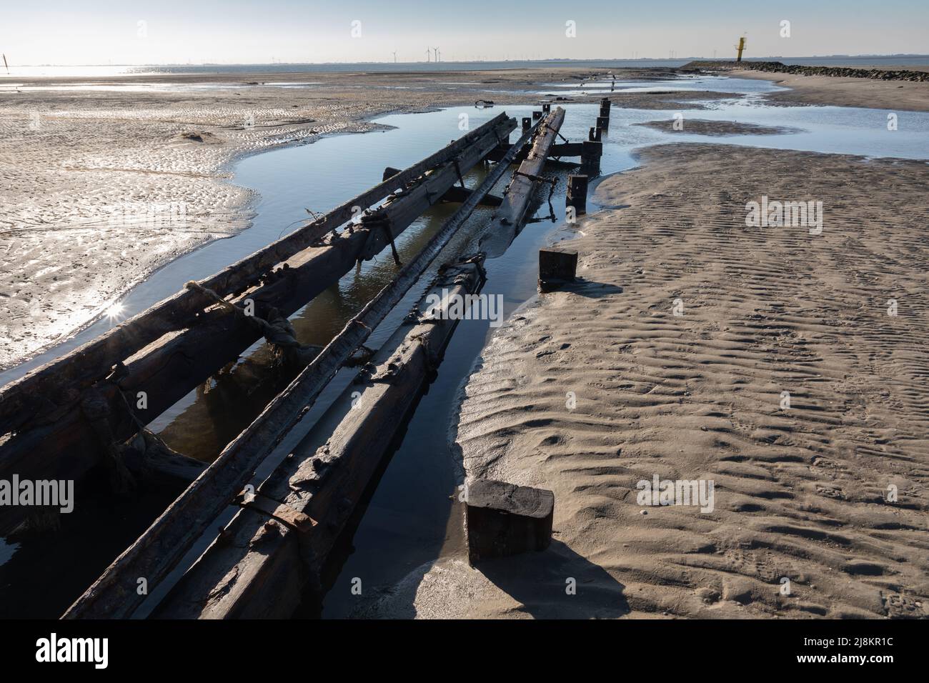 Remains of old jetty on the East Frisian island of Spiekeroog, Germany Stock Photo