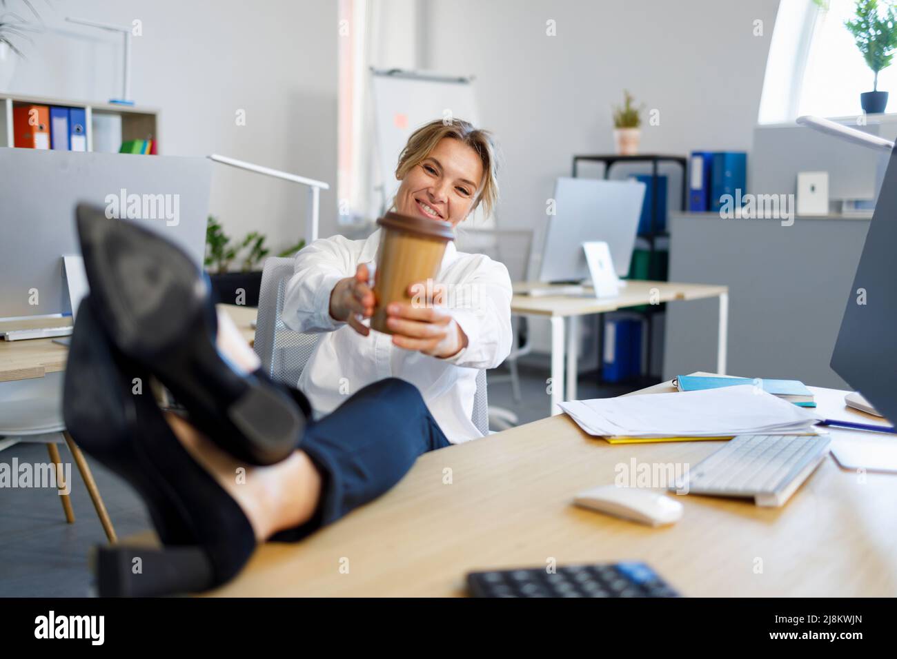 Putting legs on desk hires stock photography and images Alamy