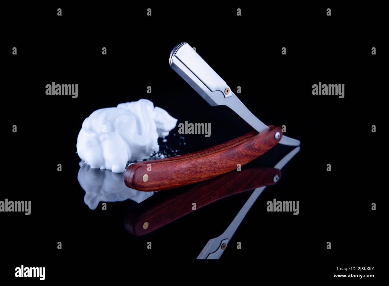 Stainless Steel Straight Edge Razor and shaving soap foam on black