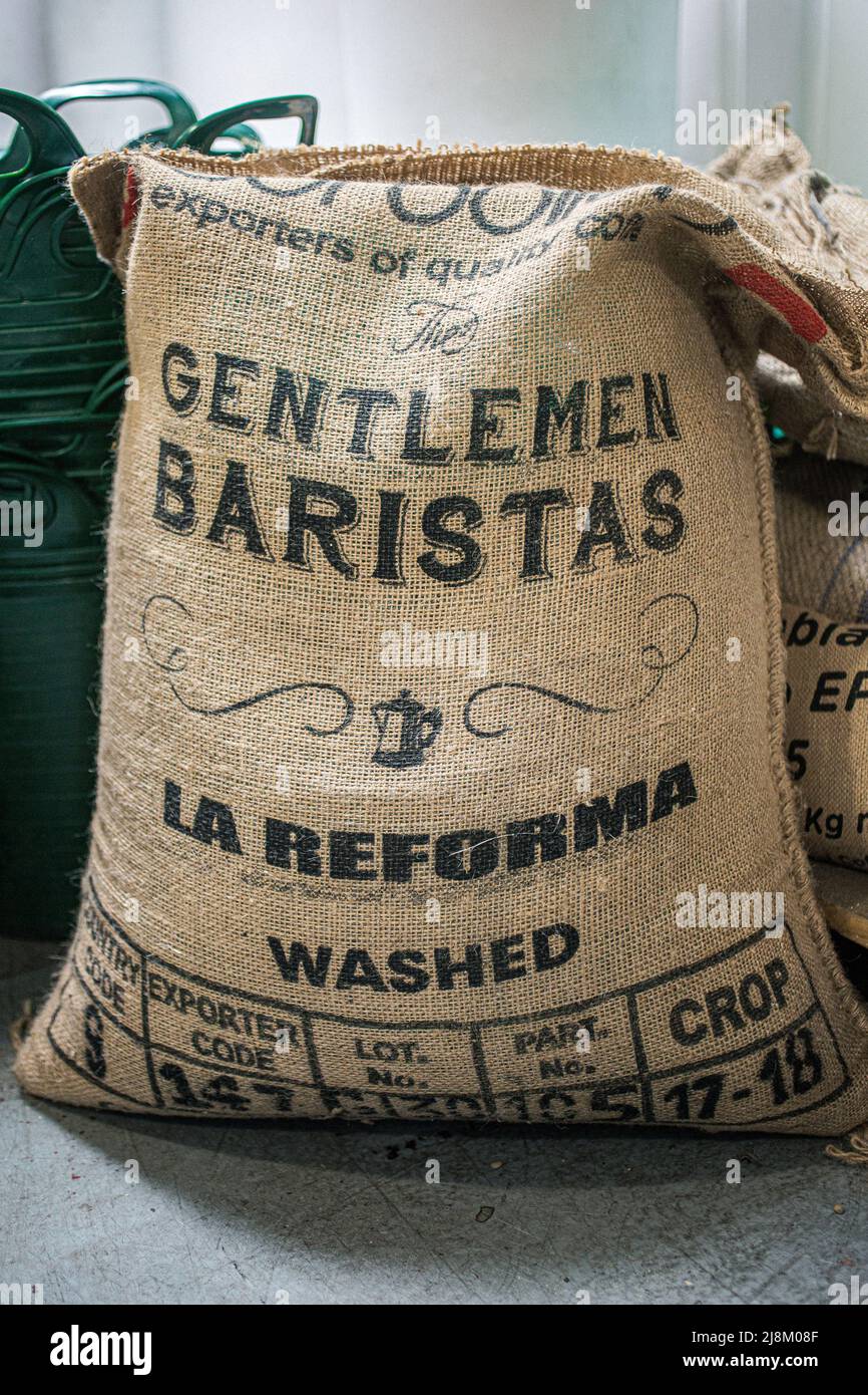 Green coffee beans in canvas sack Stock Photo