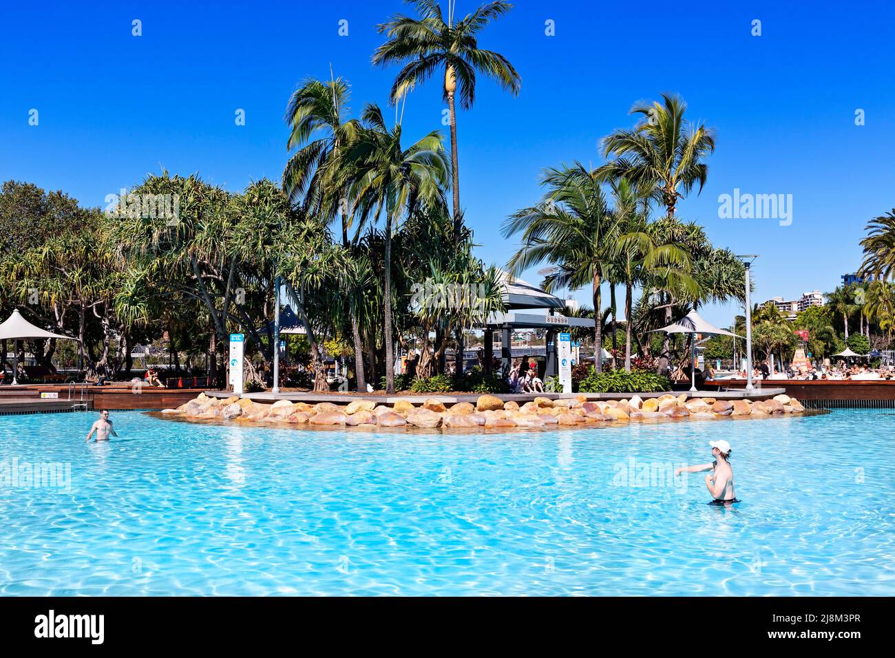 Brisbane Australia / Two young men enjoy throwing a ball at Streets