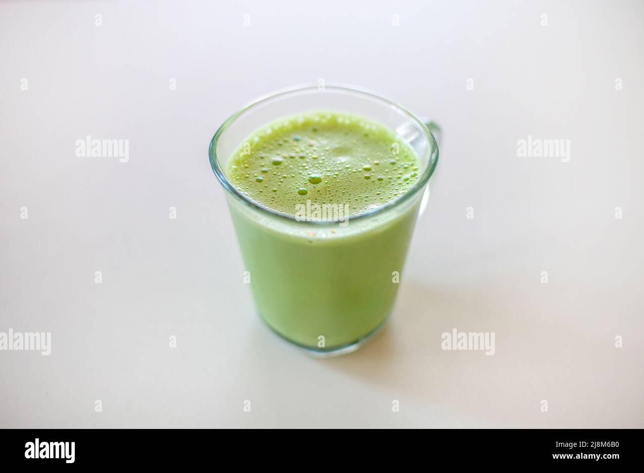 Macha Latte | Japanese Green Tea Glass cup Hot Drink isolated on white Stock Photo