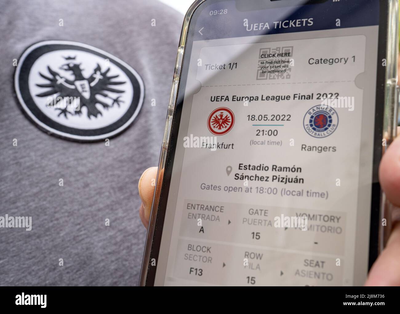 17 May 2022, Hessen, Frankfurt/Main: A fan of Bundesliga soccer club  Eintracht Frankfurt got one of the coveted tickets for the Europa League  final in Seville (May 18, 2022) between Glasgow Rangers