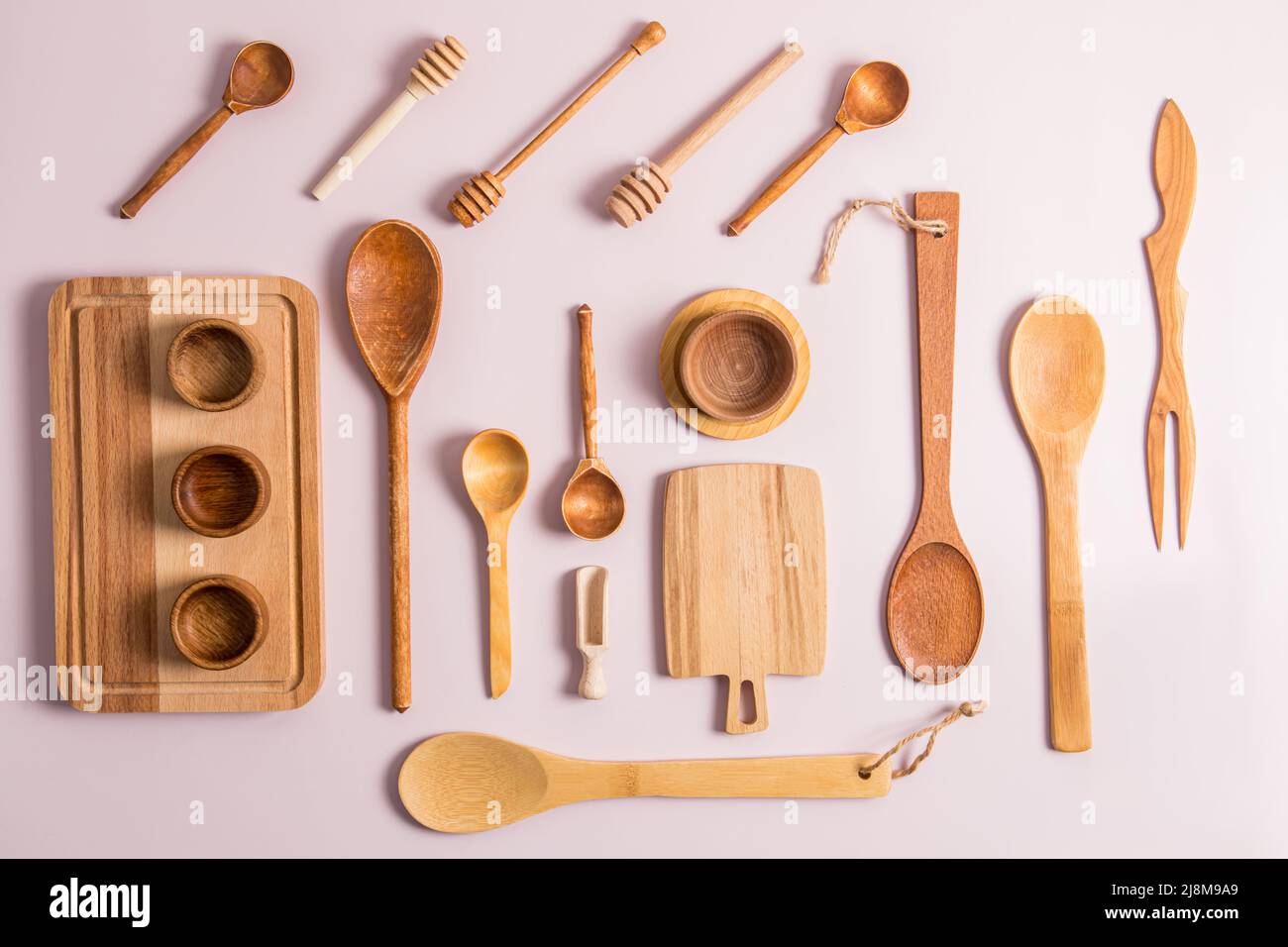 top view of a set of different wooden and bamboo kitchen utensils. flat