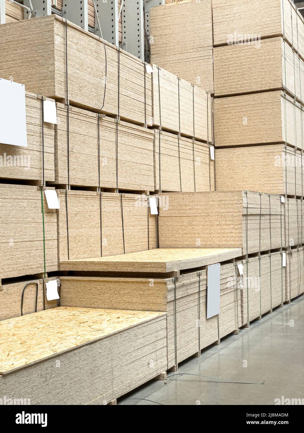 Sheet stack in a construction store. Engineered wood product for loadbearing applications in