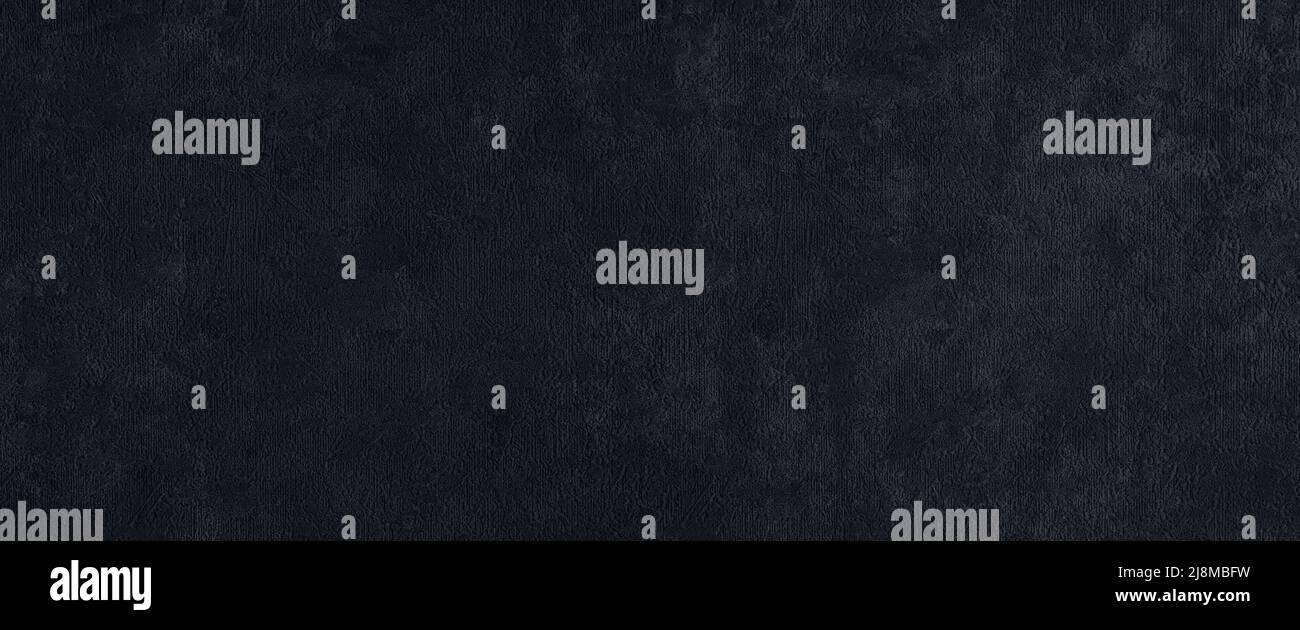 Textured dark gray wall wide panoramic texture. Grunge grey plaster