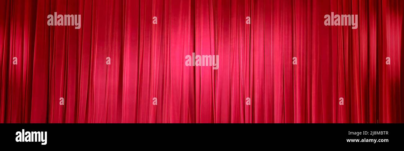 Background image of a red velvet stage curtain Stock Photo