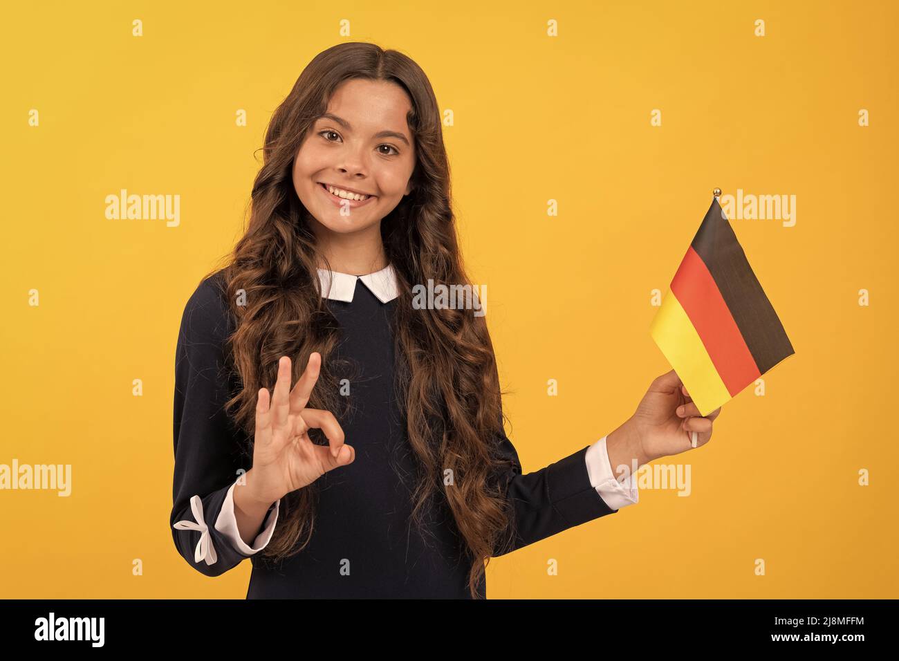 ok gesture. happy child holding german flag. touristic visa in schengen ...