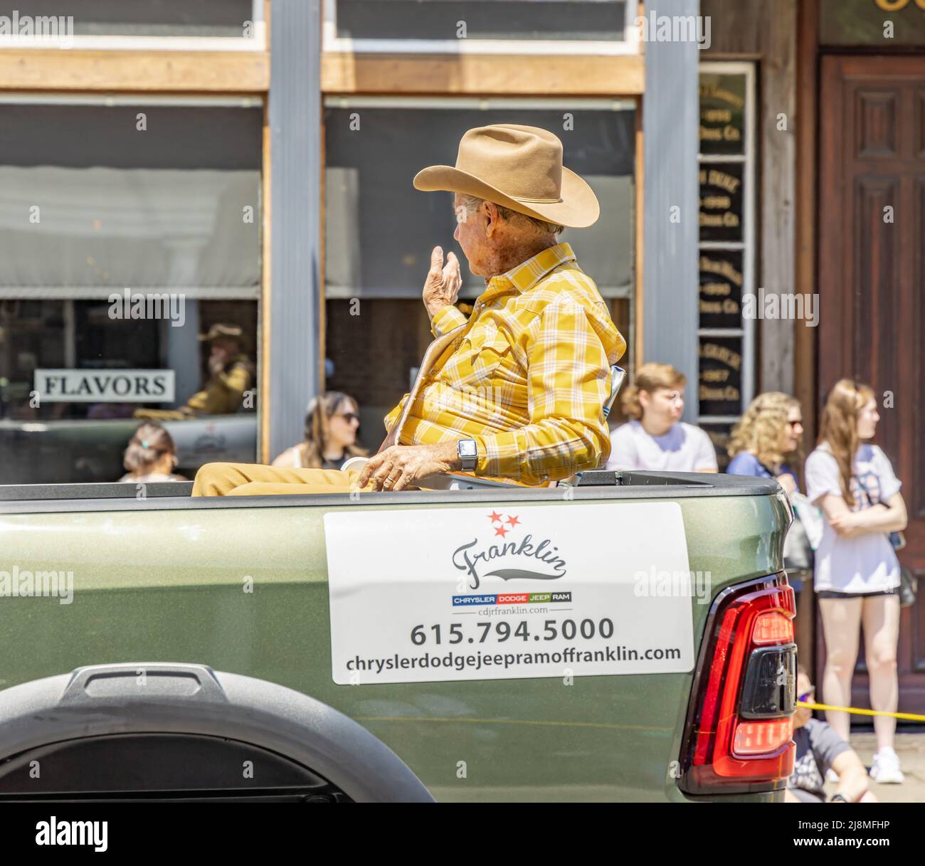 Franklin Rodeo Grand Marshall riding in the back of a Dodge Pickup truck in the Franklin Rodeo Parade Stock Photo