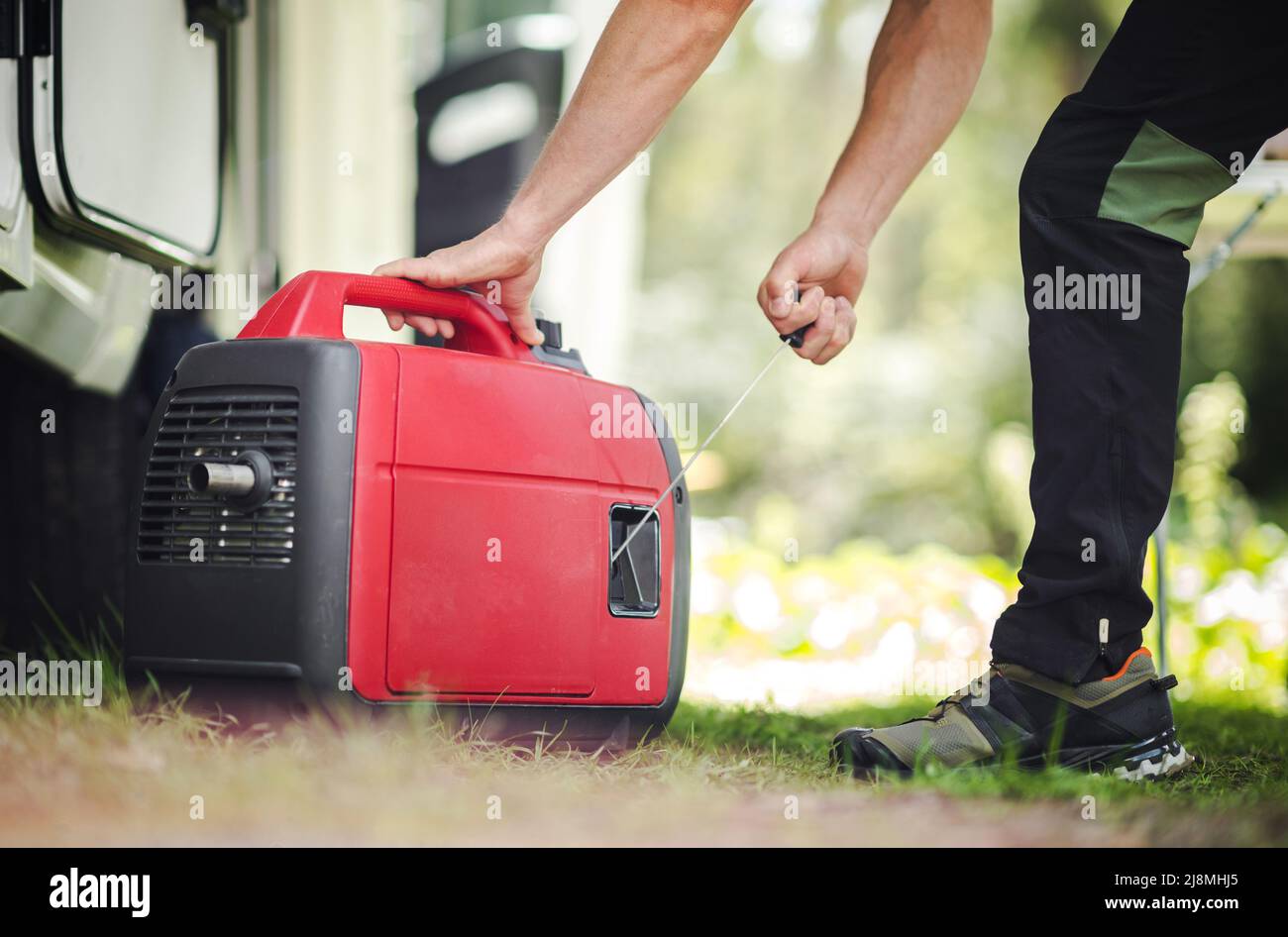 Caucasian Men Firing Portable Inverter Generator to Electrify RV Camper