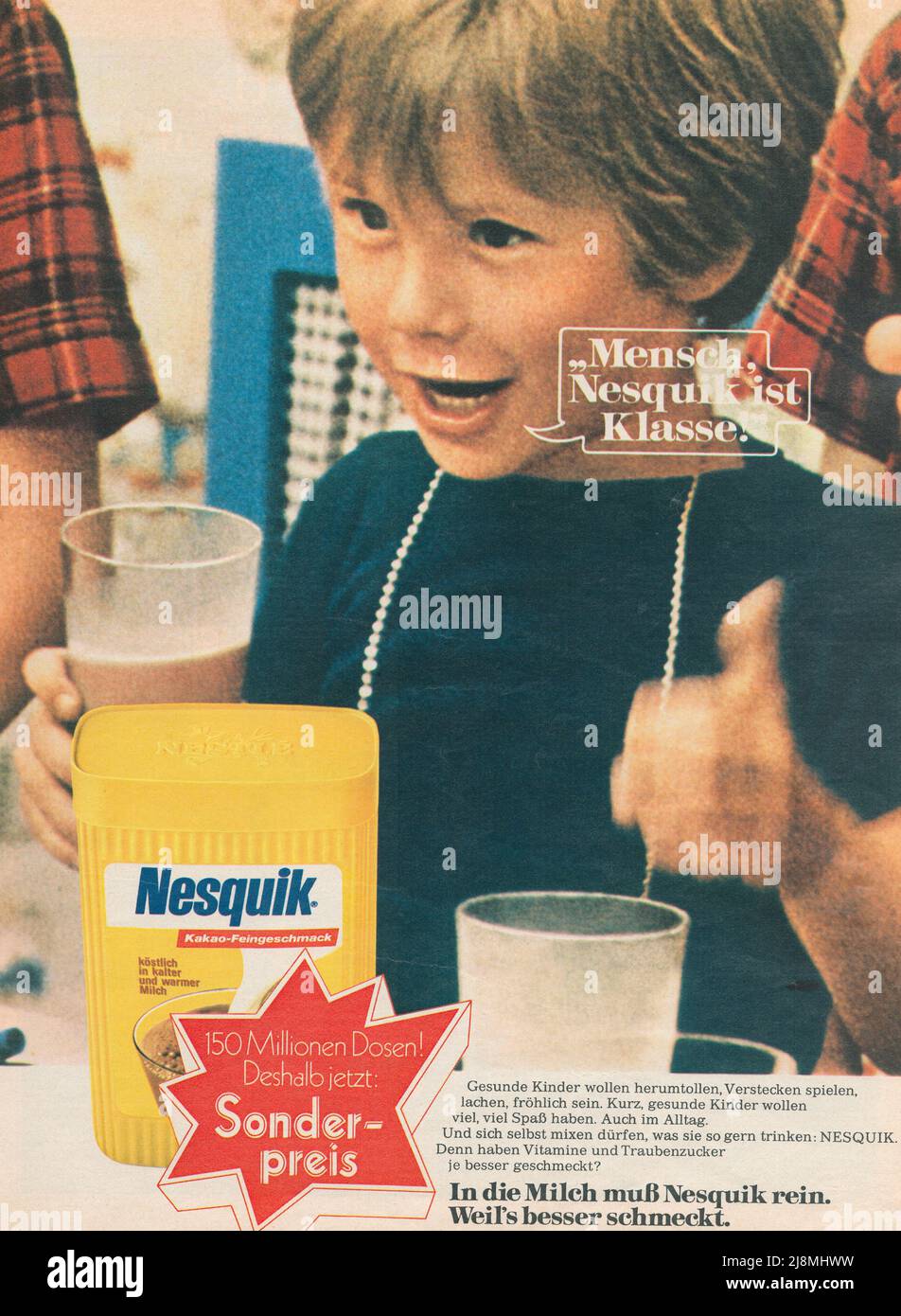 Vintage retro paper advertisement of Nesquik chocolate drink Children drinking Nesquik drink from glasses with straw German paper advert from 1980s Stock Photo