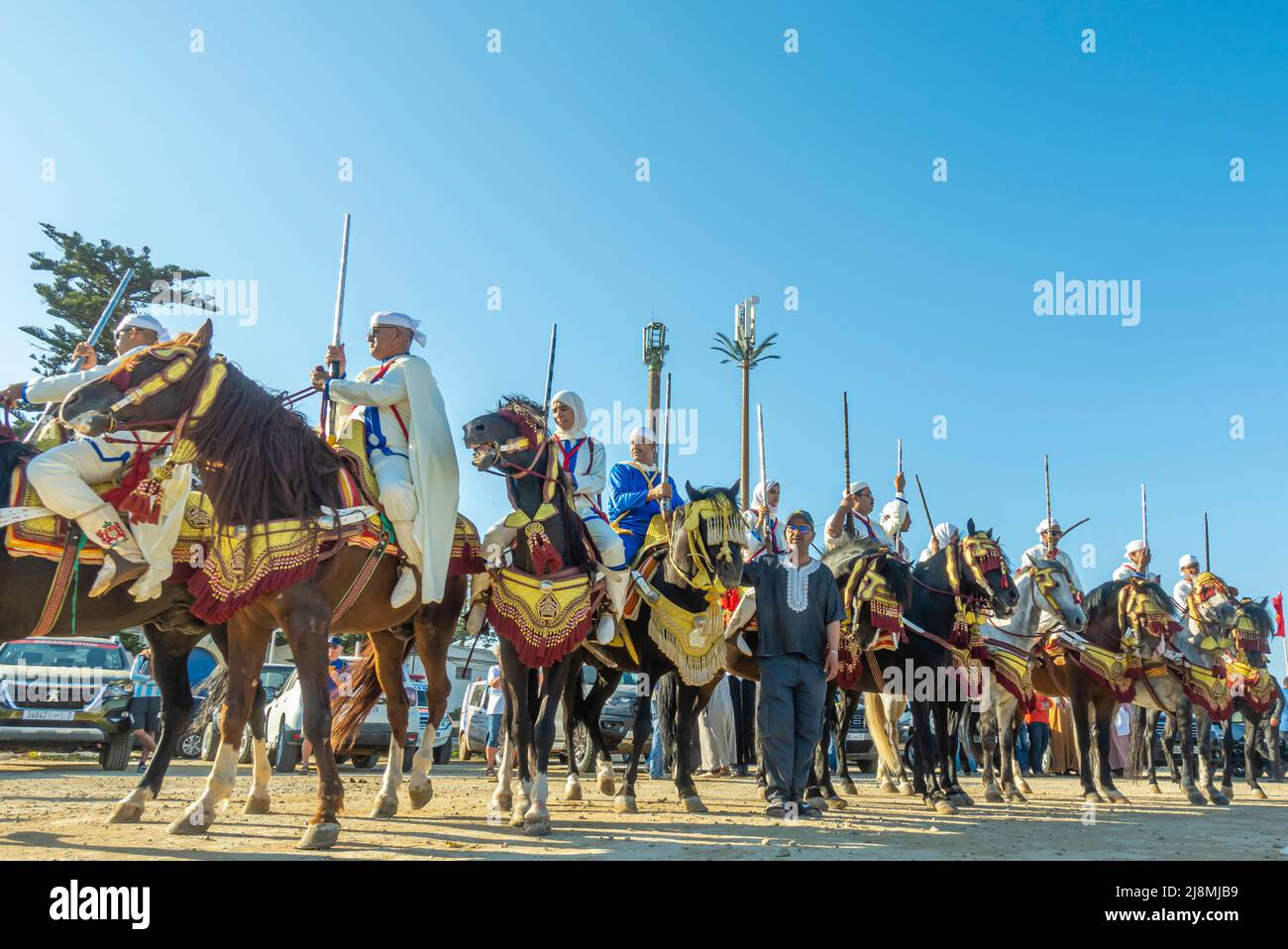 Equestrian Tbourida or Fantasia troupe at Maroc Historic rally 2020 showcase event that took place May 16, 2022 in Essaouira, Morocco Stock Photo