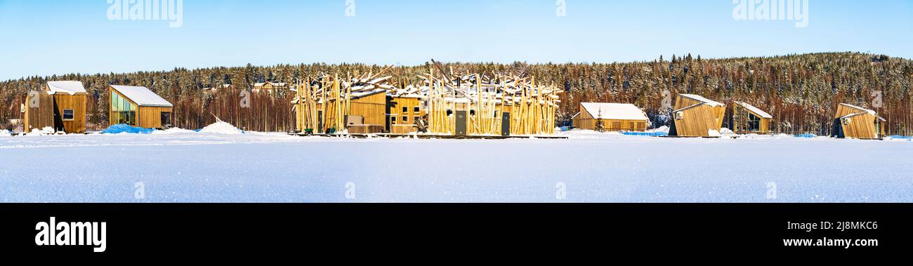 Panoramic view of the Arctic Bath Spa hotel surrounded by the snowcapped forest in winter,  Harads, Lapland, Sweden Stock Photo