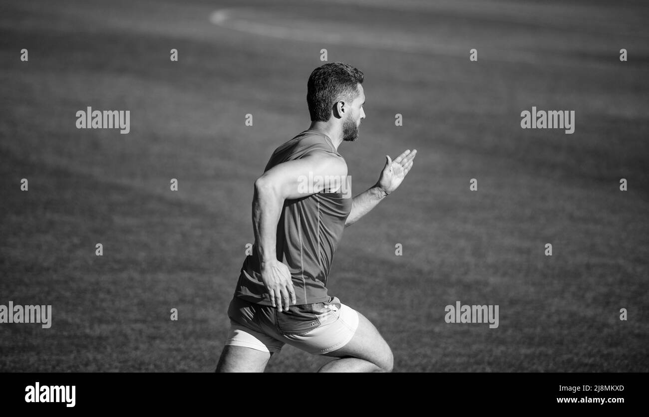 Towards the healthier lifestyle. runner run on running track. energetic and sporty. marathon speed energy. muscular man. athletic man compete in Stock Photo