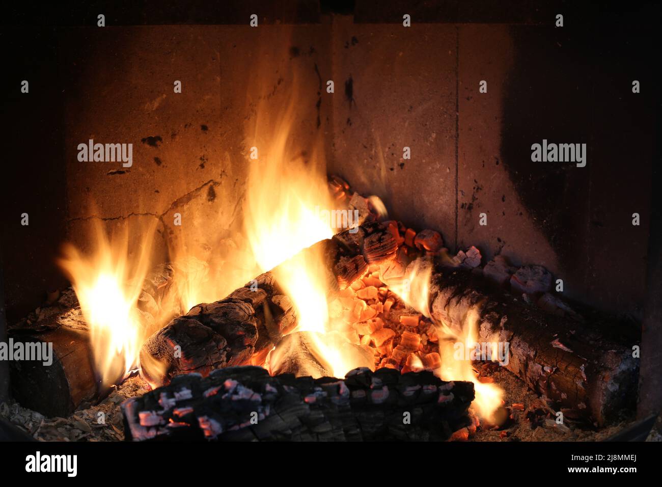 Bright burning wood in a fireplace with sparks closeup Stock Photo Alamy