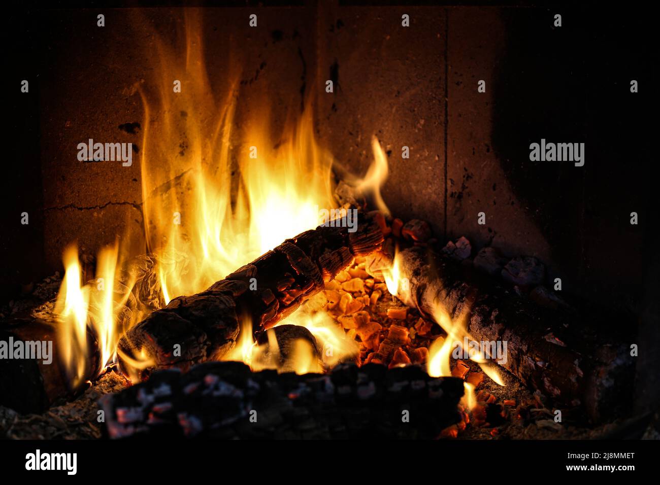 Bright burning wood in a fireplace with sparks closeup Stock Photo Alamy