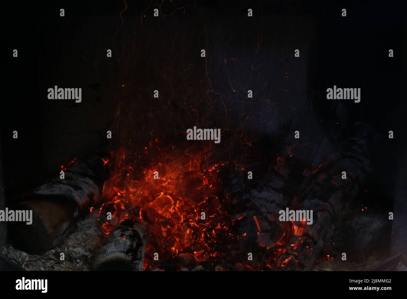 Bright burning wood in a fireplace with sparks close-up Stock Photo - Alamy