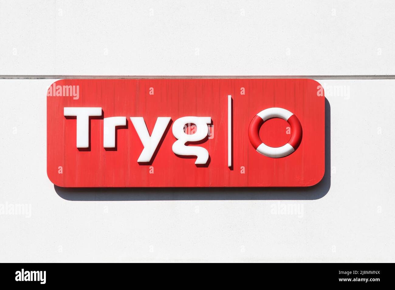 Aarhus, Denmark - April 16, 2022: Tryg logo on a wall. Tryg is a ...