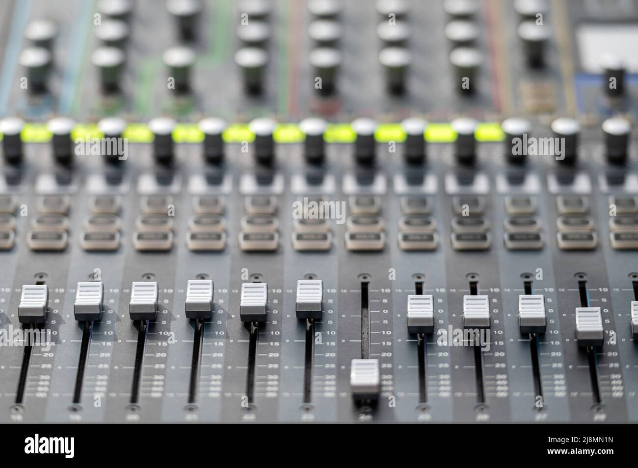 Sound and audio mixer control panel with buttons and sliders. Audio