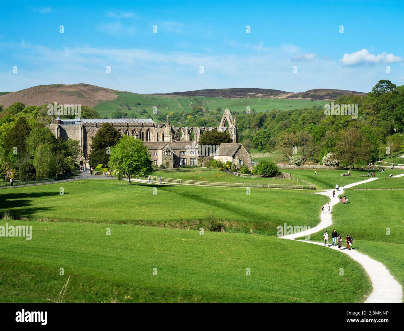 The ruins of Bolton Priory set in the valley by the River Wharfe at Bolton Abbey North Yorkshire England Stock Photo