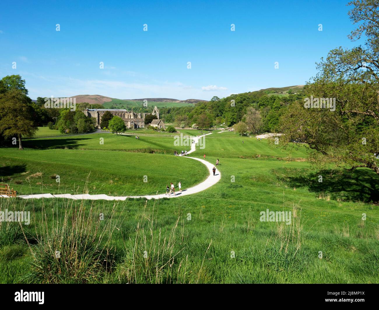 The ruins of Bolton Priory set in the valley by the River Wharfe at Bolton Abbey North Yorkshire England Stock Photo