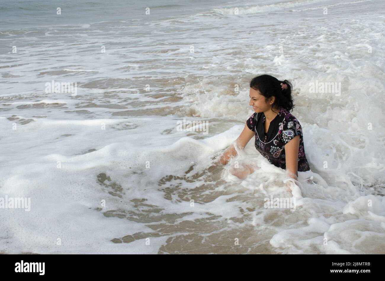 A pretty girl is bathing at beach Stock Photo - Alamy
