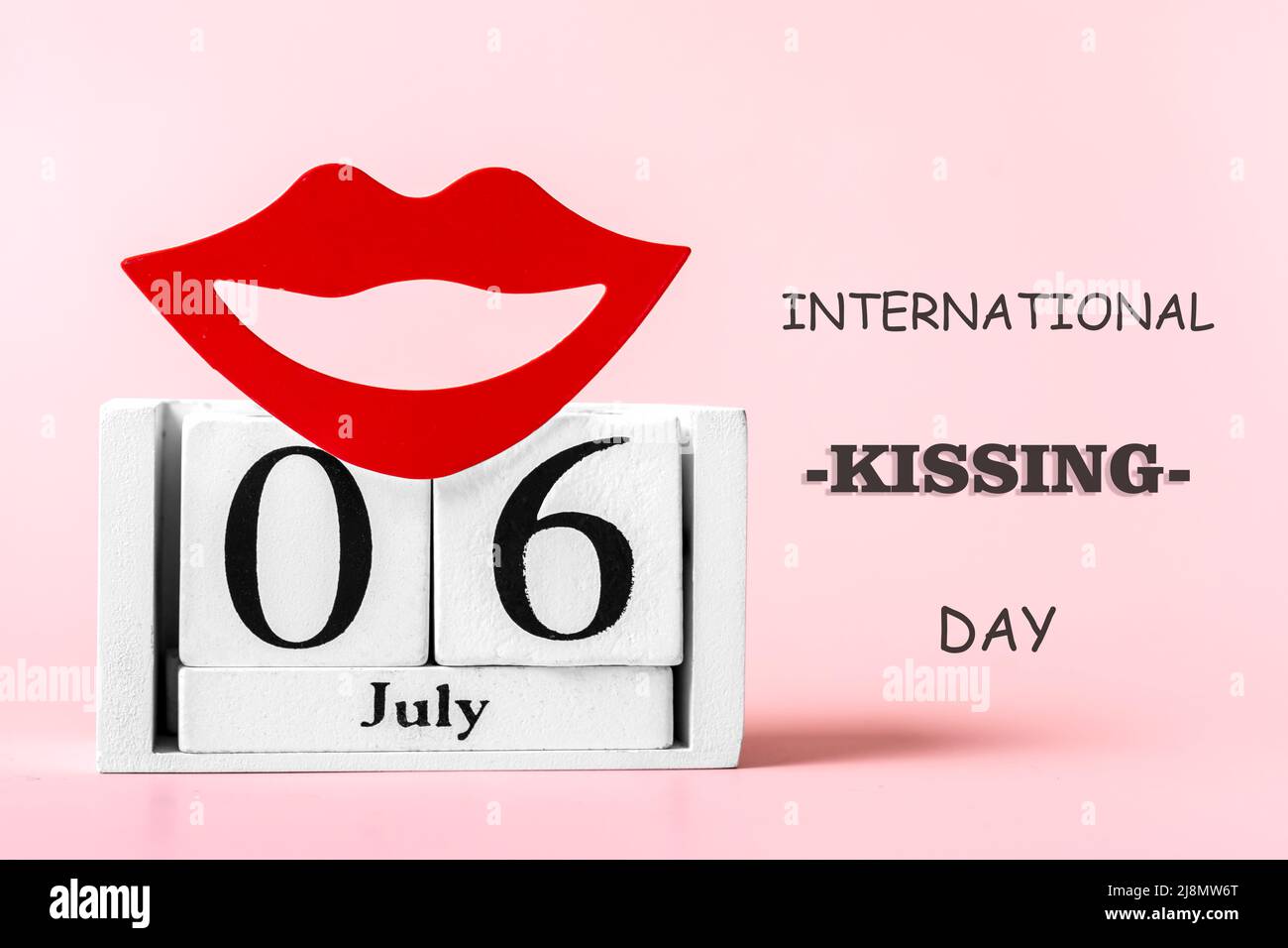 Red lips, calendar isolated on pink background 06 July International