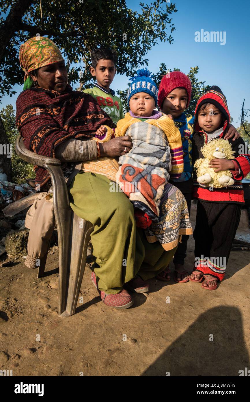 13th february 2022. Dehradun, Uttarakhand, India. A group shot of kids with their mother in a village in India. Stock Photo