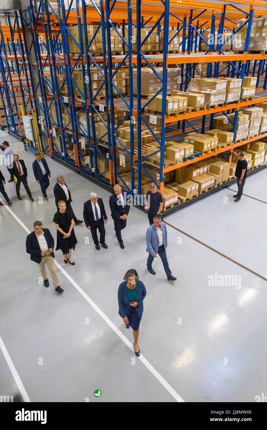 17 May 2022, Saxony-Anhalt, Magdeburg: Tamara Zieschang (M, CDU), Minister of the Interior of the State of Saxony-Anhalt, walks through the elevated warehouse of the Clothing Service Center (BSC) of the Police Inspectorate Central Services Saxony-Anhalt (PI ZD). Behind the Minister walks Michael Richter (M, CDU) Finance Minister of the State of Saxony-Anhalt, who officially handed over the new building to the Minister of the Interior after two years of construction. From the BSC, about 6500 police officers and about 2000 justice employees of the state are served. Photo: Klaus-Dietmar Gabbert/d Stock Photo